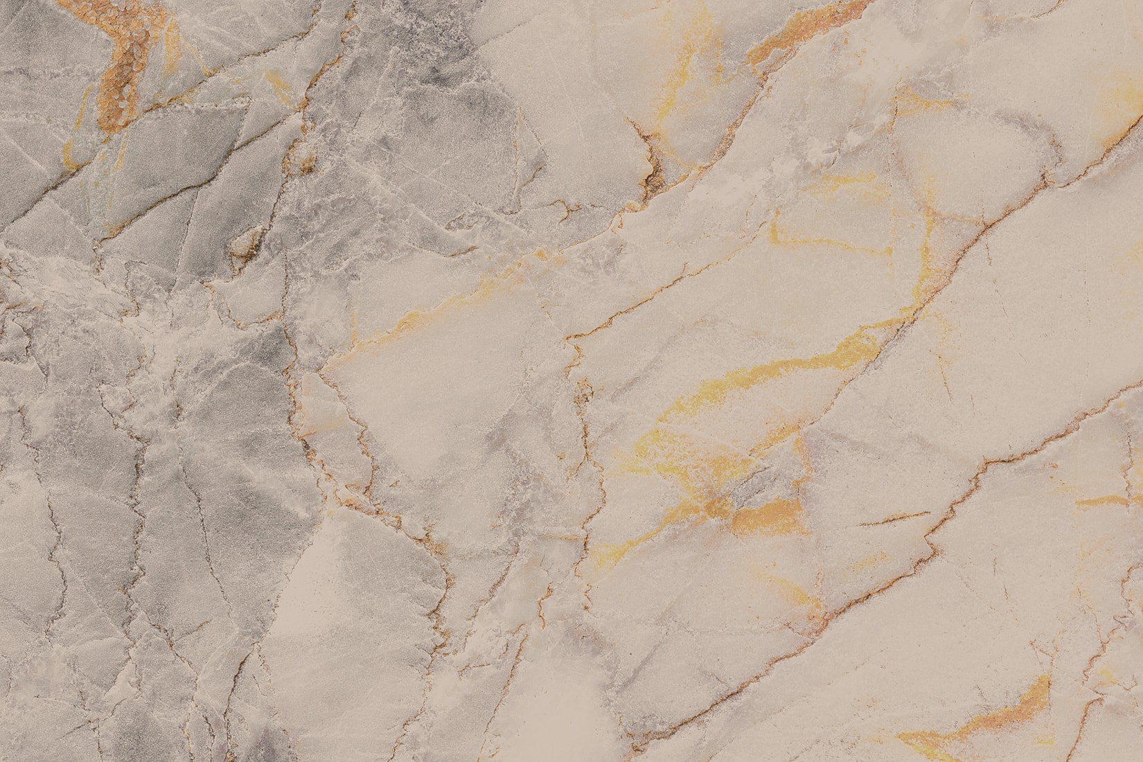 Textured marble surface with gray and gold hues.