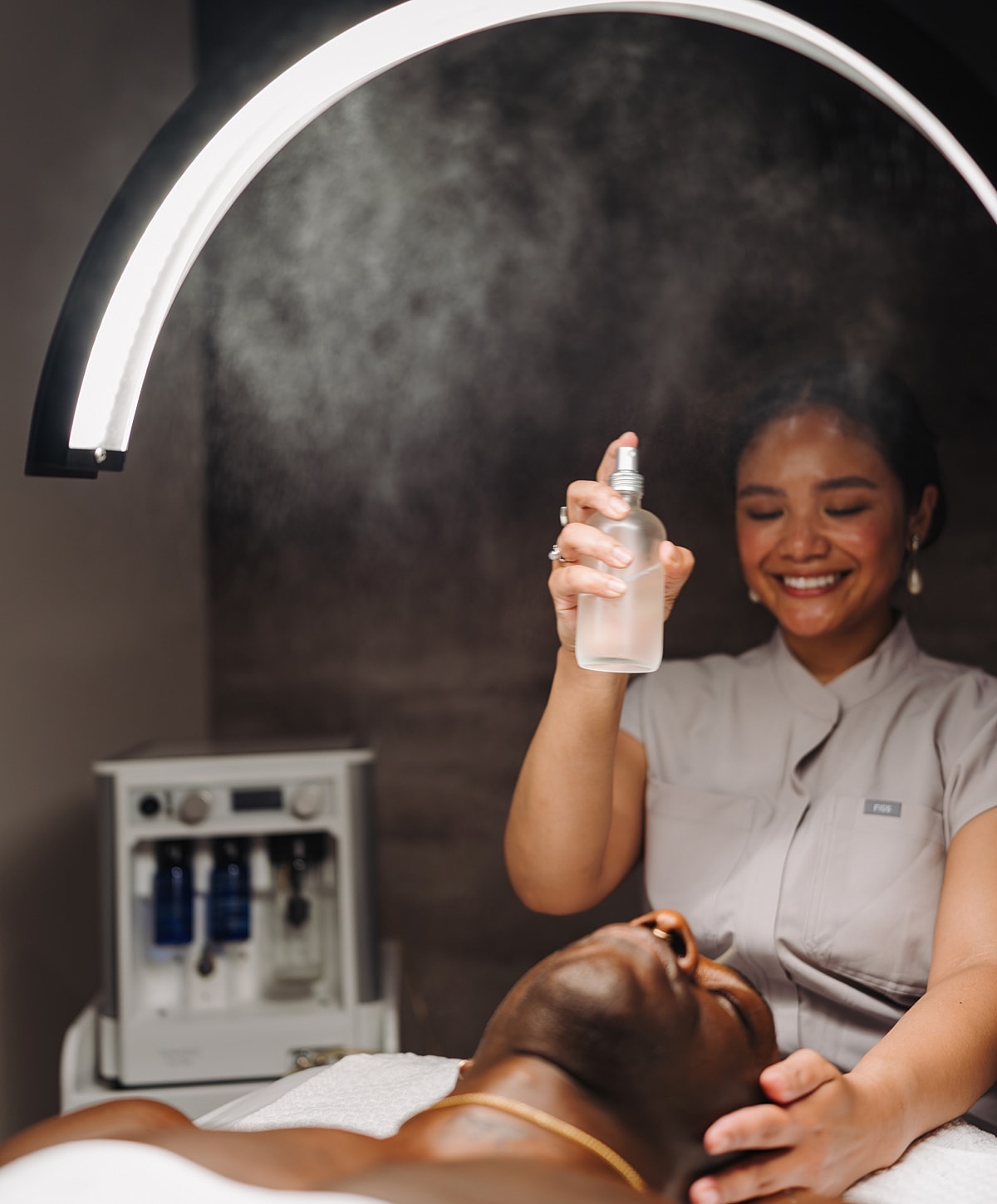 Spa treatment with facial mist application.