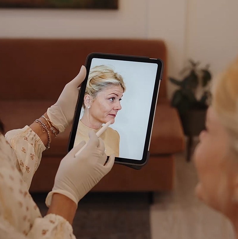 Consultation using a tablet and digital image.