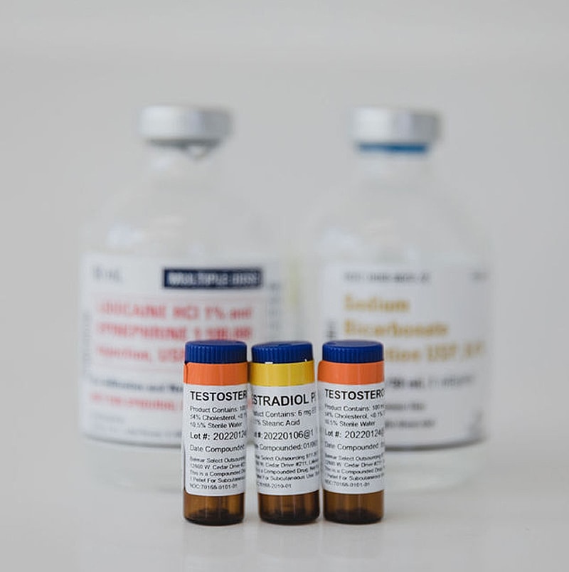 Medical vials and bottles with labels.