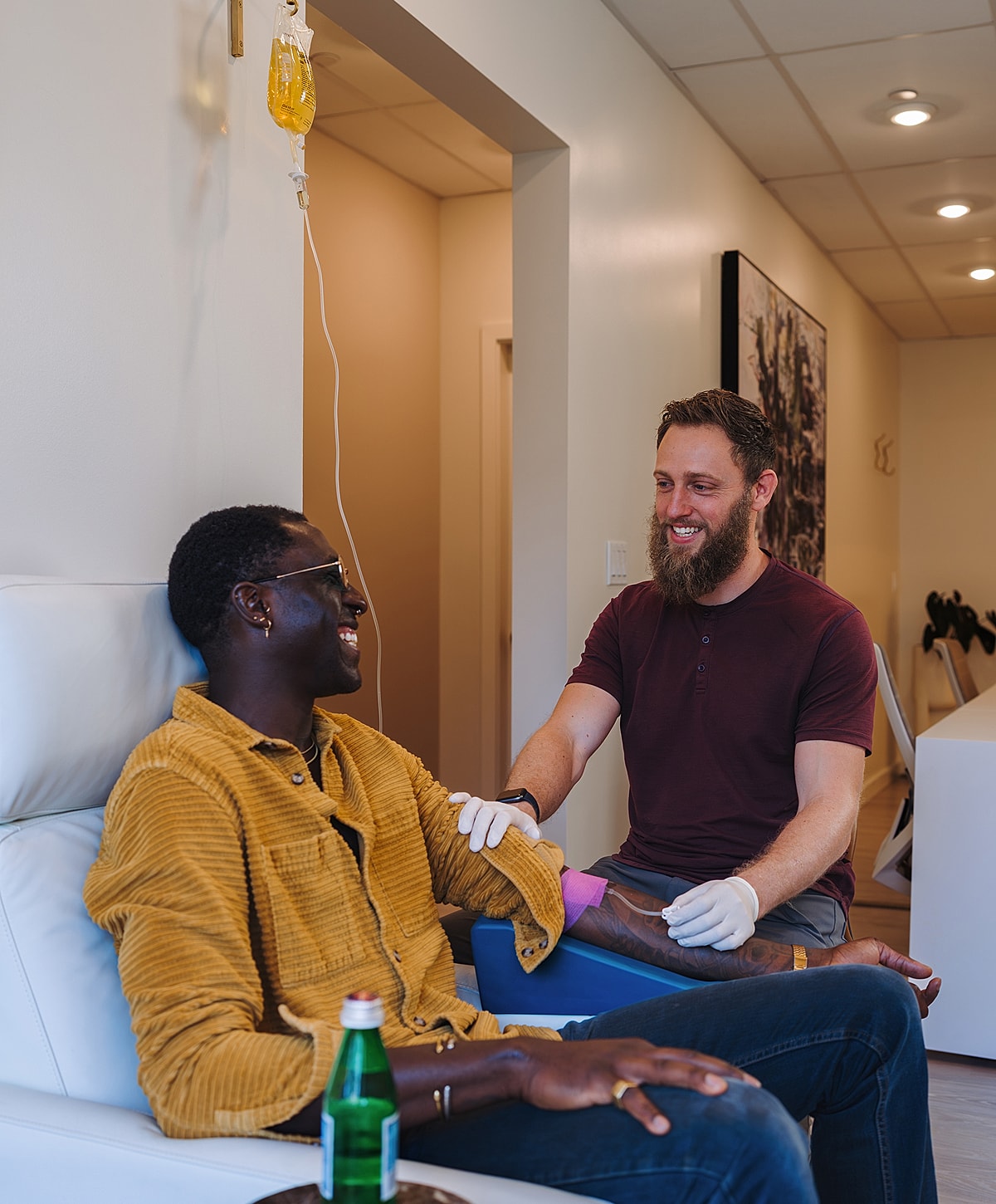 Patient receiving IV treatment in a clinic.